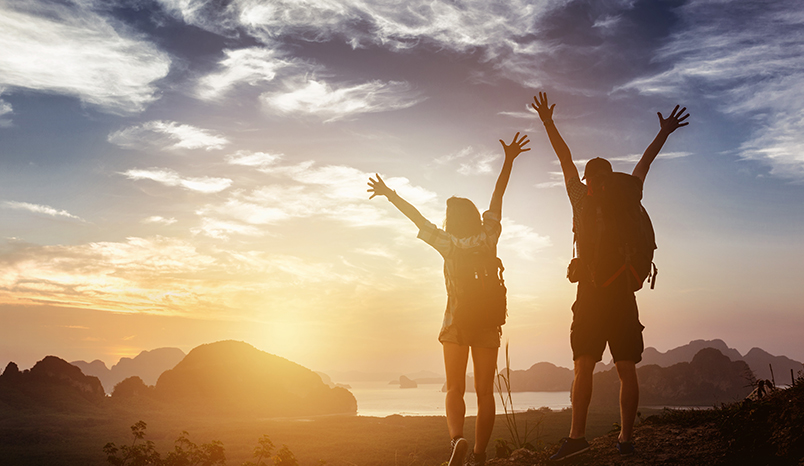 Two hikers celebrating a successful hike