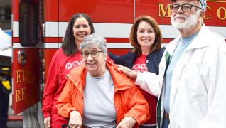 Group of people in front of a first responder truck