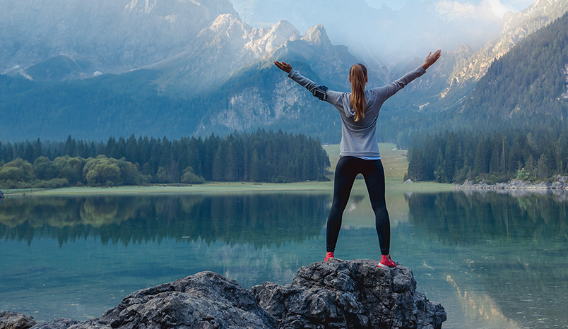 Runner enjoying a rest near a lake