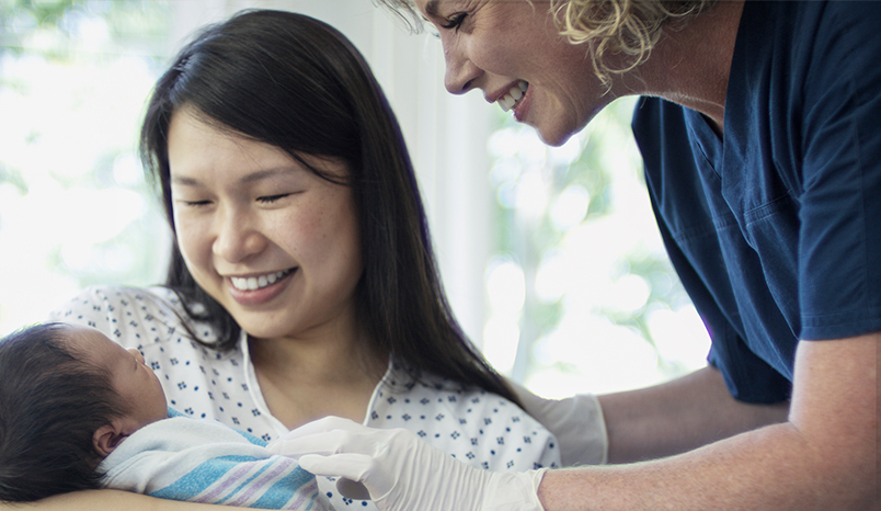 Parents holding newborn