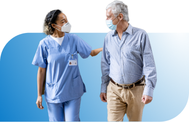 medical staff walking with senior patient