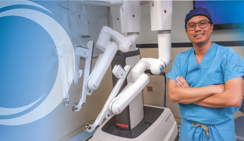 Dr. Pham with robotic surgery equipment.