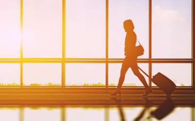 Woman walking with suitcase