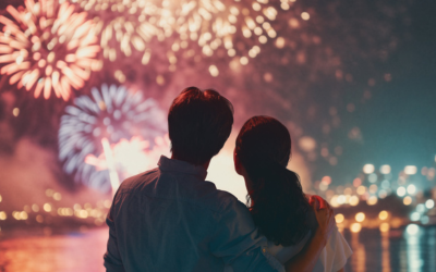 Couple watched professional fireworks display.