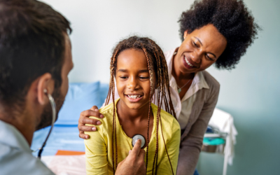 Doctor examines young patient.