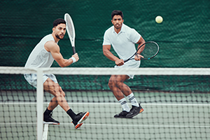 Two men playing tennis