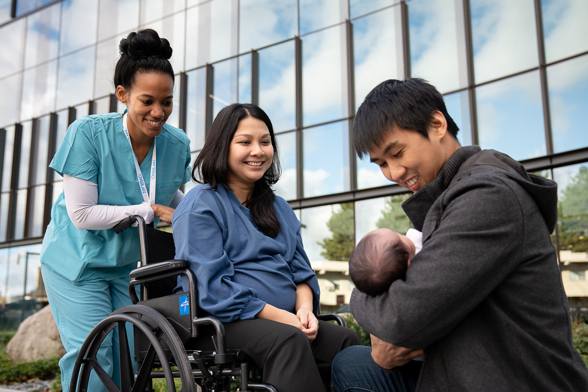 New parents with baby and nurse