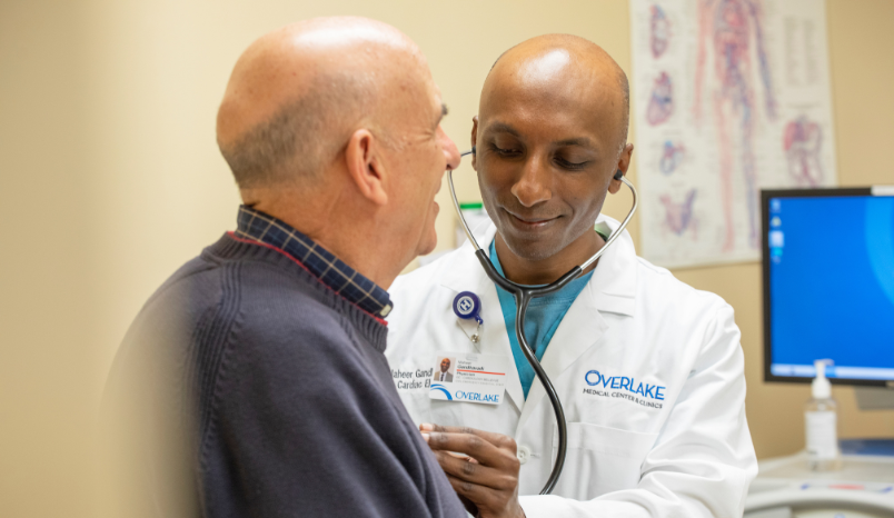 Overlake cardiologist listens to patient's heart.