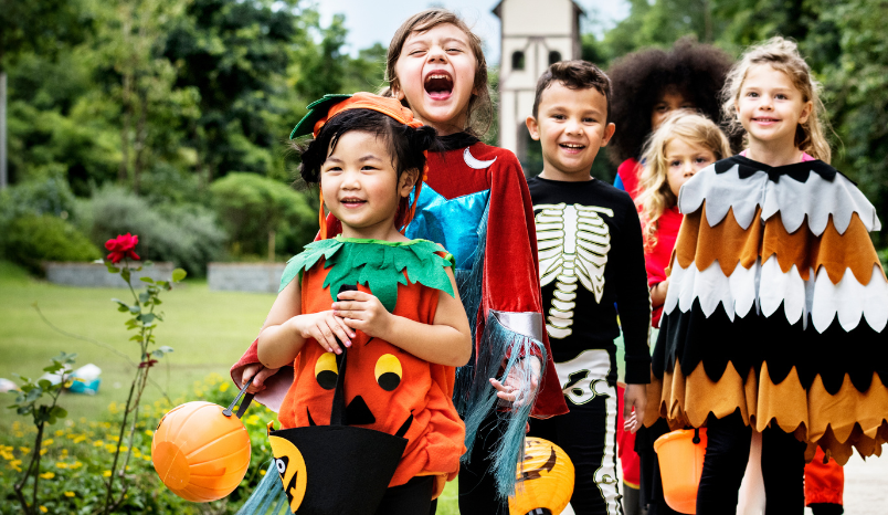 Kids in costume trick-or-treating.