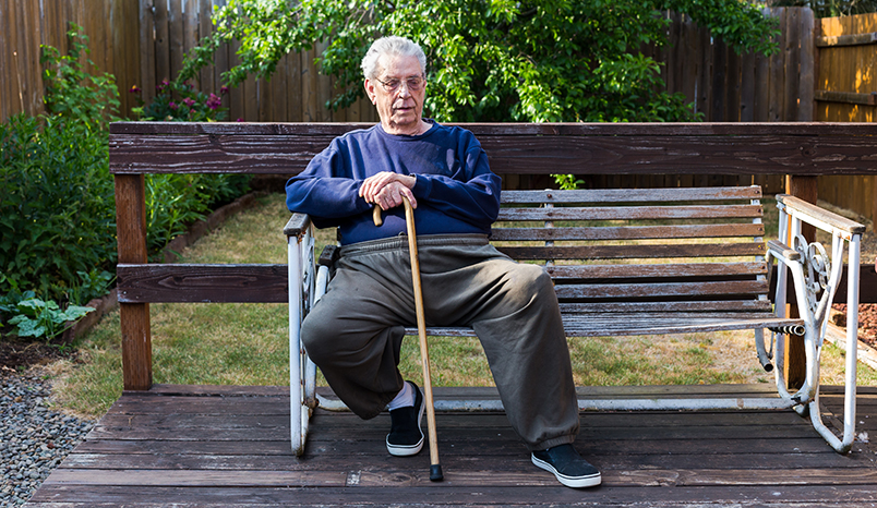 Elder man sitting on bench