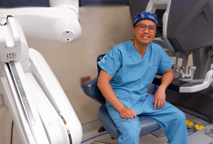 Dr. Pham with robotic surgery equipment.