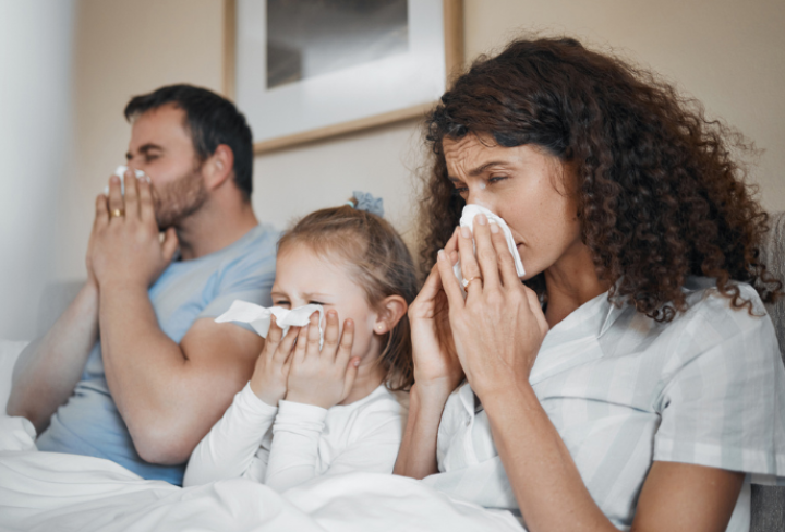 Family of three at home sick.