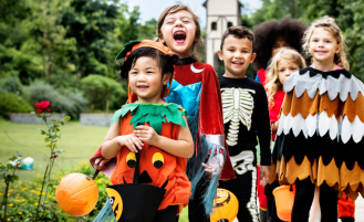 Kids in costume trick-or-treating.